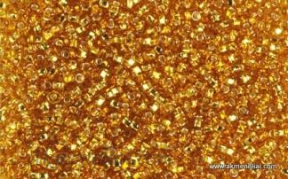 PRECIOSA rocailles.Originali 50 g pakuotė. 10/0 dydis. rudas gintaro skaidrus su folija